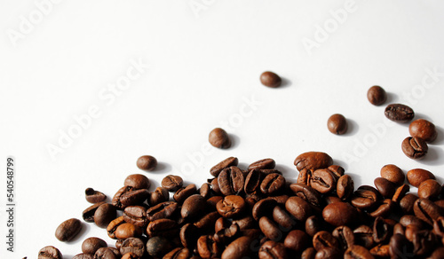 brown coffee beans on white background with space for text, coffee wallpaper, roasted coffee beans texture on white, roastet coffee beans background