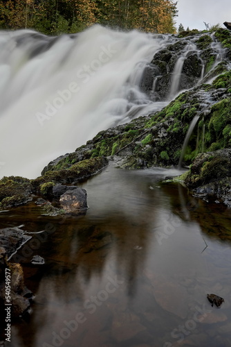 Fototapeta Naklejka Na Ścianę i Meble -  Stormy stream of Kivach waterfall in autumn Karelia