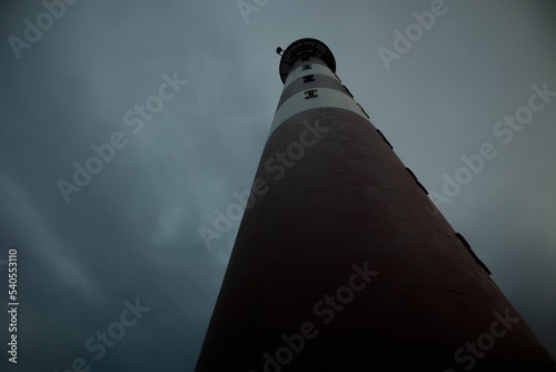 Low-angle view of a Bornrif lighthouse in the Netherlands against the gloomy sky photo