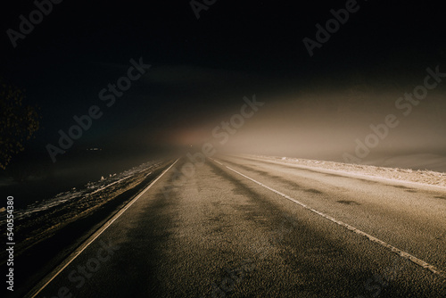 Foggy misty road at night