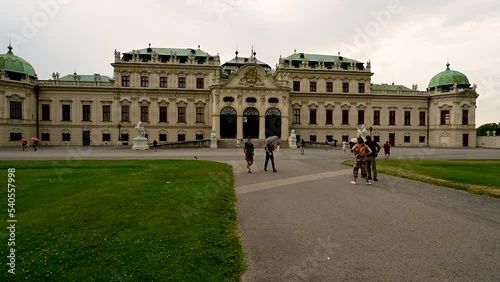 Vienna, Austria, August 2022. Amazing pov footage as we walk towards the entrance of the Belvedere palace, we pass by other people who are visiting. photo