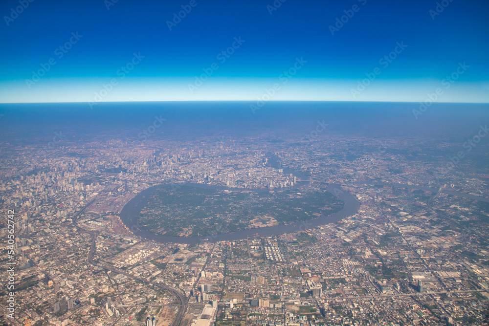 Aerial view of a metropolitan city and the main river surrounding it