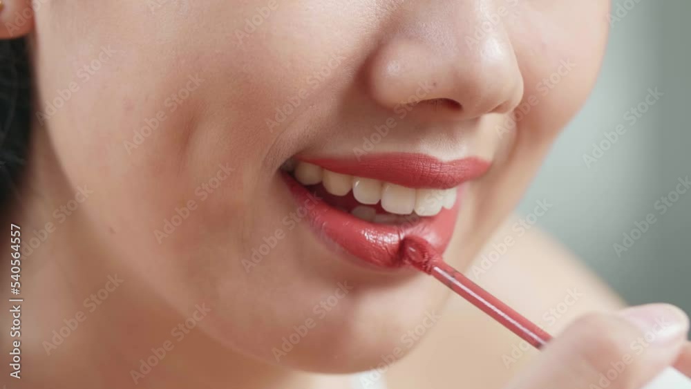 Close Up Of Smiling Young Asian Woman Applying Lipstick While Wearing Makeup At Home
Close Up Of Smiling Young Asian Woman Applying Lipstick While Wearing Makeup At Home