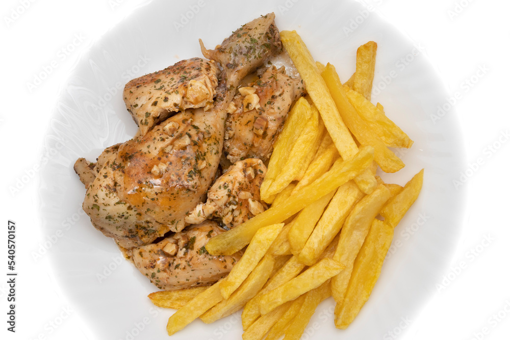 A plate of garlic chicken with pommes frites. On white background. Spanish food concept. A plate of garlic chicken with pommes frites. On white background. Spanish food concept.