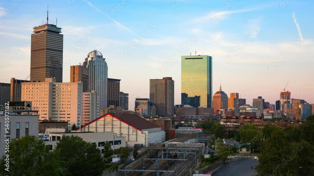 Aerial Lockdown Time Lapse Shot Of Trains Moving On Tracks In City From Day To Night - Boston, Massachusetts Aerial Lockdown Time Lapse Shot Of Trains Moving On Tracks In City From Day To Night - Boston, Massachusetts