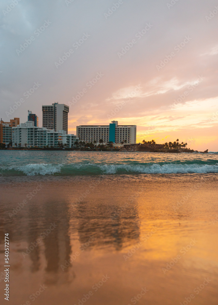 Naklejka premium Sunset sky with buildings background in the city coast beach of condado puerto rico