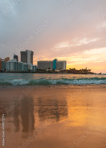 Sunset sky with buildings background in the city coast beach of condado puerto rico