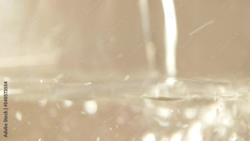 Mineral water fills a glass glass close-up Mineral water fills a glass glass close-up
