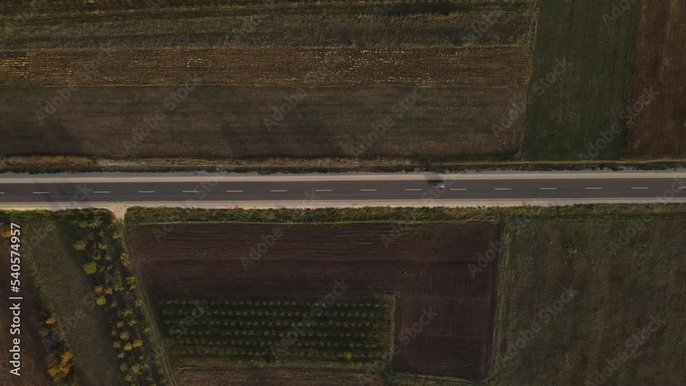 car drive on the road aerial drone view top down in autumn day car drive on the road aerial drone view top down in autumn day