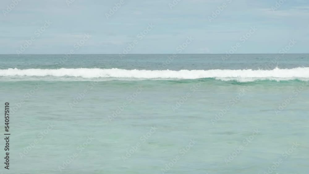 Breaking Ocean wave on a sandy beach Breaking Ocean wave on a sandy beach