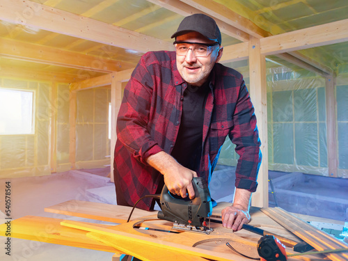 Man builder. Worker with el...