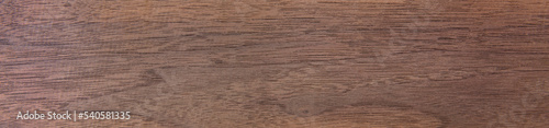 Black walnut (Juglans nigra) wood texture, in wide format. Raw unfinished surface. Highly prized for its dark-colored, straight grained heartwood and ease of workability in furniture making. 