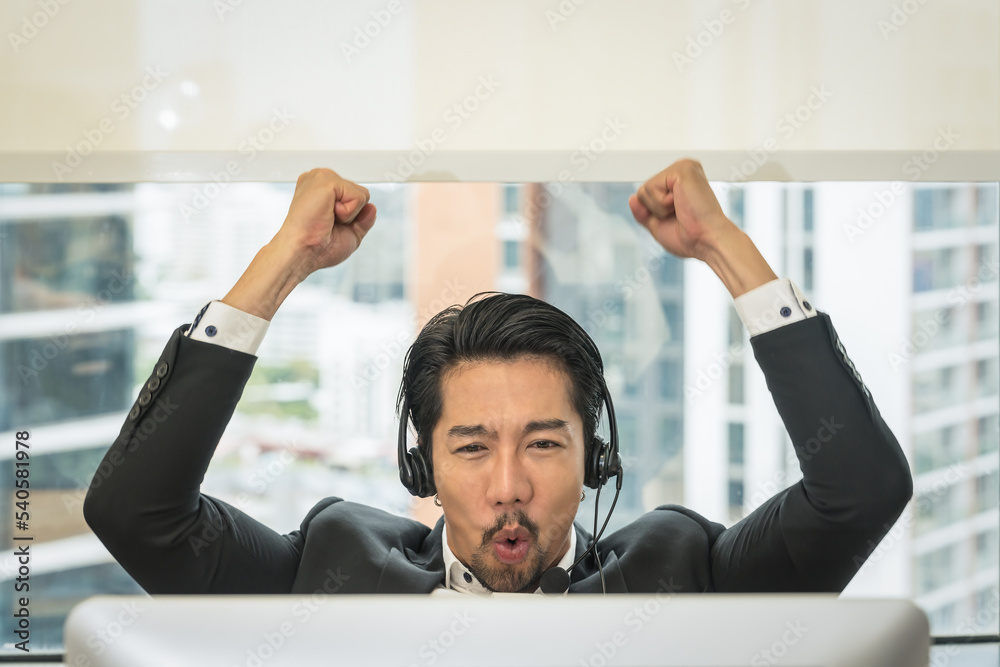 businessman or call center or helpdesk or service support agent feeling happy and exiting with raise arrms businessman or call center or helpdesk or service support agent feeling happy and exiting with raise arrms
