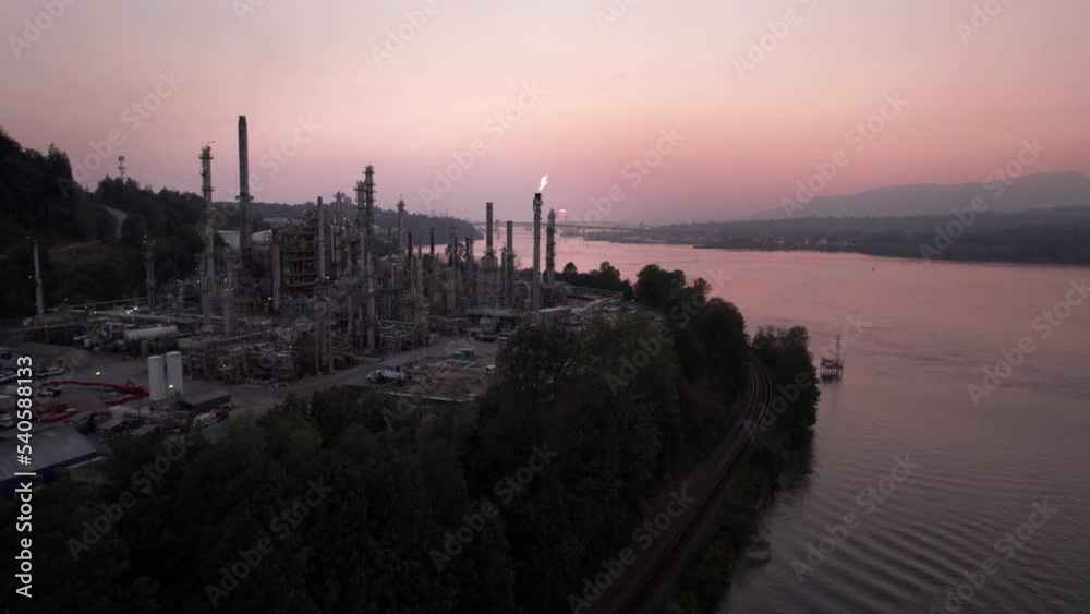Oil refinery with oil storage and burn off towers, natural gas