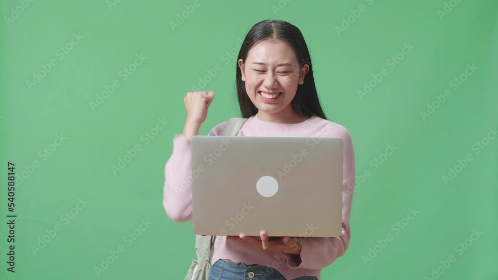 Asian Woman Student Using Laptop Computer And Celebrating On Green Screen Studio
Asian Woman Student Using Laptop Computer And Celebrating On Green Screen Studio