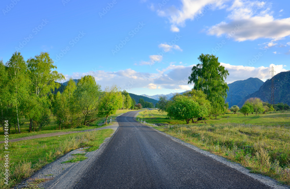 A road in a mountain valley A road in a mountain valley