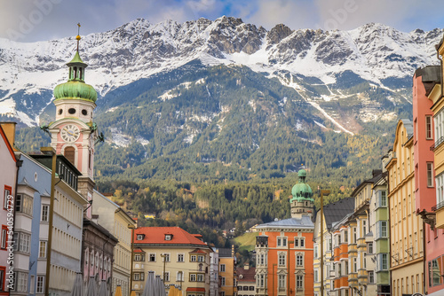 Innsbruck Old town and snowcapped karwendel mountain at sunset in Tyrol, Austria