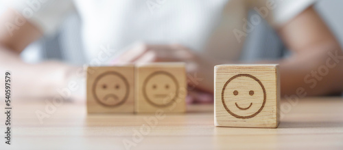 Billede på lærred Happy smile face choosing from Emotion block for customer review, good experienc