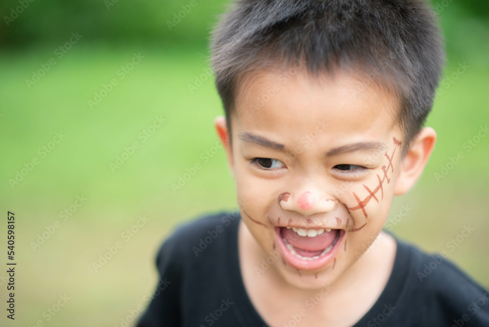 Asian kids play peekaboo halloween face theme