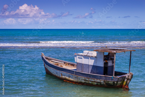 Porto Seguro Beach at sunset with fishing trawler motorboat in BAHIA  Brazil