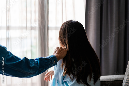 Young man comforting and supporting a sad woman who is in serious trouble at home, Consolation and encouragement concept