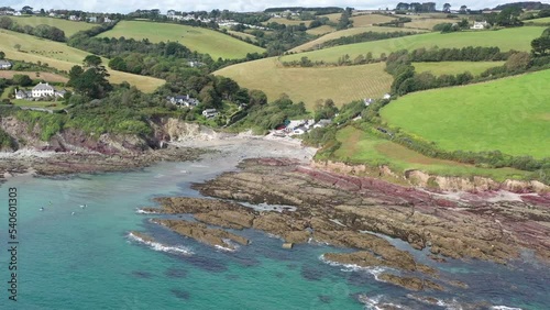 Wide rising aerial view of Talland Bay, Cornwall, UK. Between the town of Looe and village of Polperro. photo