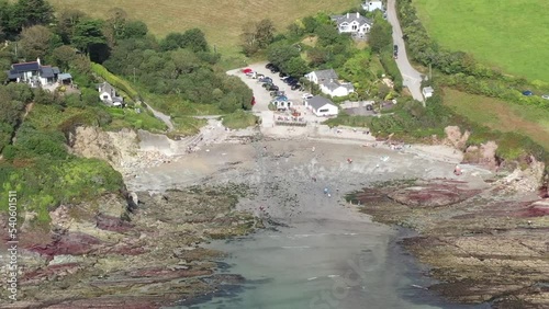 Aerial view pushing into Talland Bay, on the South West Coastal path between the Cornish Town of Looe, and village of Polperro. photo