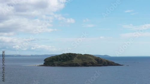 Wide low aerial view of St. Georges Island, off the Cornish coast near the town of Looe. photo