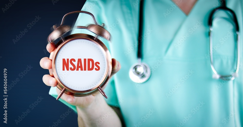 NSAIDs (Non-steroidal anti-inflammatory drugs). Doctor shows alarm clock with medical text. Background blue. NSAIDs (Non-steroidal anti-inflammatory drugs). Doctor shows alarm clock with medical text. Background blue.