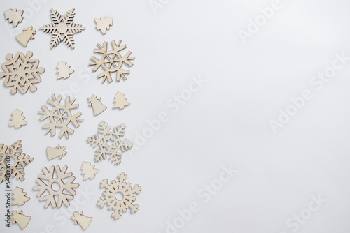 Christmas winter festive ornament. Christmas snowflakes decoration, pine trees and bells on white background. Christmas holiday decoration. Minimal holiday greeting season.