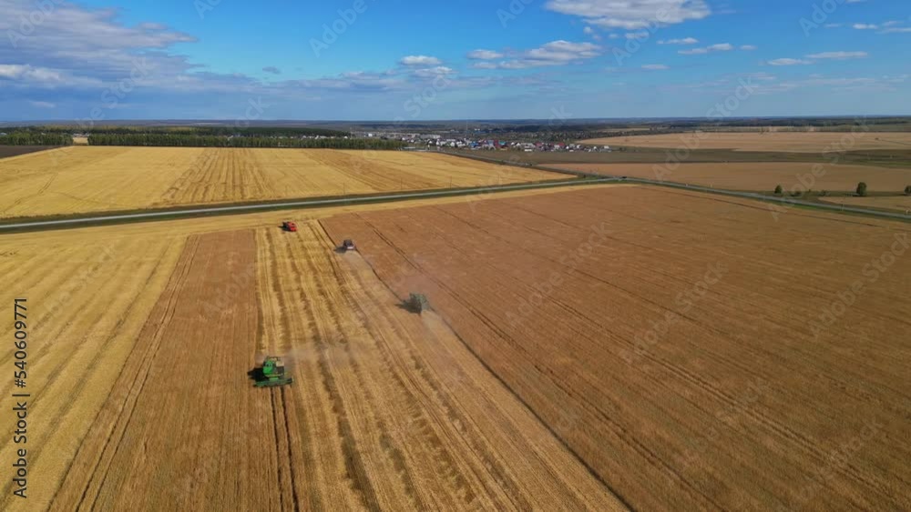 Different Agriculture Machines Harvesting Grain in Wheat Field Drone Point of View. Different Agriculture Machines Harvesting Grain in Wheat Field Drone Point of View.
