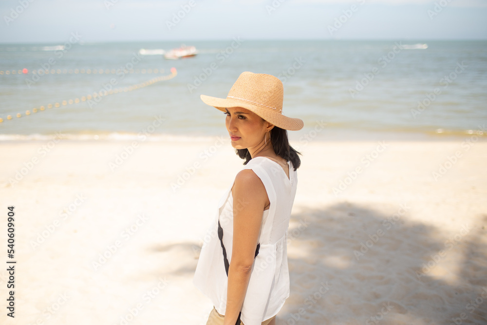 side view of beautiful woman on the beach side view of beautiful woman on the beach