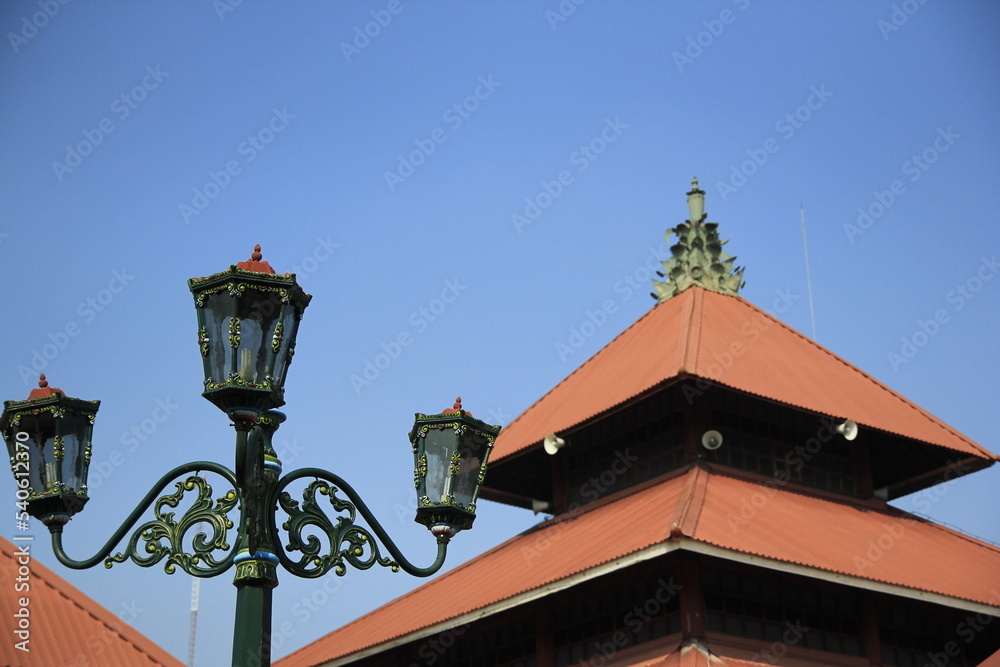 Decorative lights with background of the great mosque of Kauman Yogyakarta, which has a Javanese architectural style.
