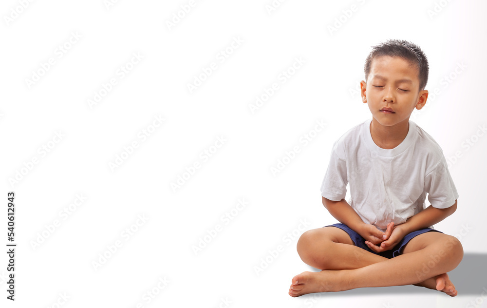 asian boy meditating on white background