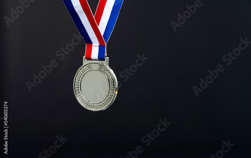 Blank silver medal on black background
