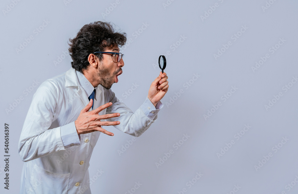 Scientist holding a magnifying glass looking to the side, Man in a white coat with a magnifying glass looking advertisement, Surprised scientist observing with a magnifying glass to the side Scientist holding a magnifying glass looking to the side, Man in a white coat with a magnifying glass looking advertisement, Surprised scientist observing with a magnifying glass to the side