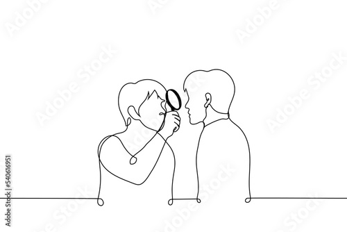 man looks at man through magnifying glass - one line drawing vector. concept a man studies another, alien too strange person