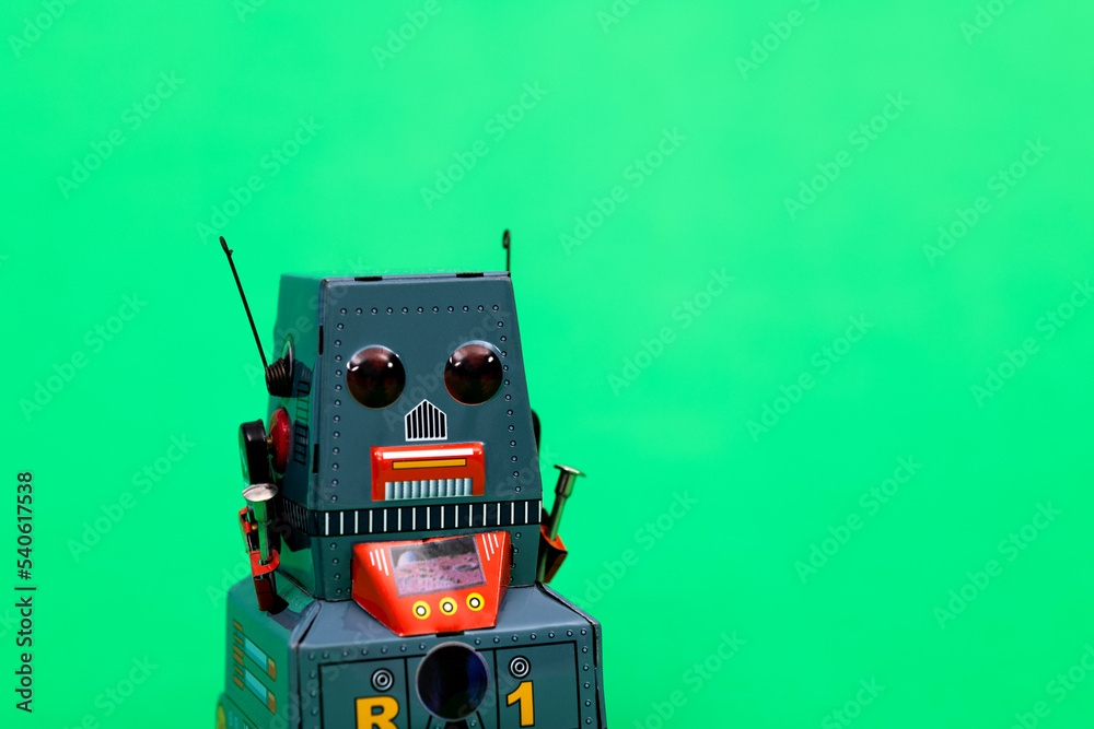 Fototapeta premium Retro robot toy on green background