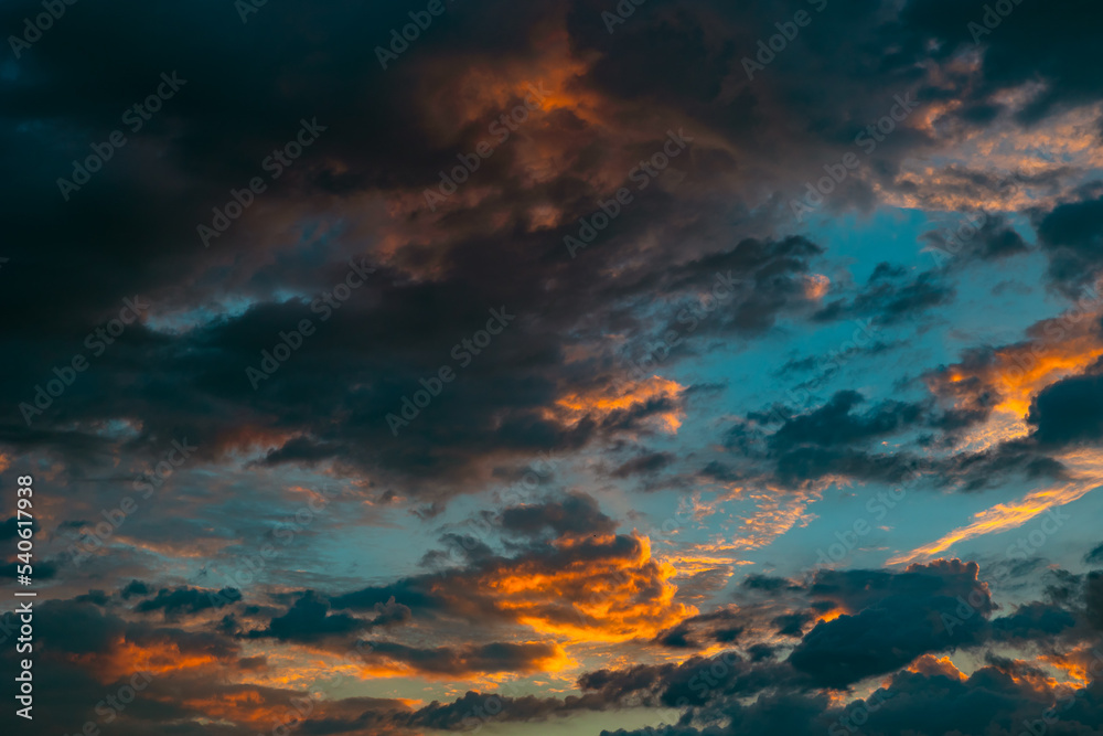 Dramatic clouds at sunrise. Cinematic cloudy sky backdrop or background photo