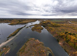 panoramic view from a drone of a network of lakes and islands with a yellow forest against the backdrop of autumn colors
