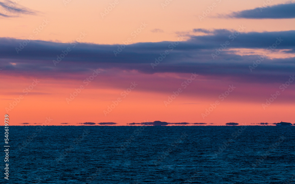 Shimmering horizon over the sea during sunrise
