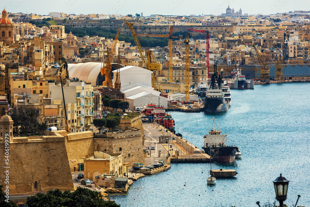 Old city walls and harbor on Mediterranean sea in Valletta, Malta. Old city walls and harbor on Mediterranean sea in Valletta, Malta.