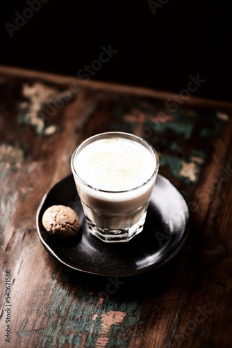 Coffee with milk on dark wooden background. Soft focus. Copy space.