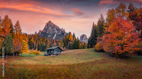 Captivating autumn sunrise on Canali valley, Piereni location, Province of Trento, Italy, Europe. Impressive morning scene of Dolomite Alps. Beauty of countryside concept background.