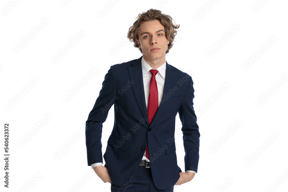 elegant young businessman posing with hands in pockets elegant young businessman posing with hands in pockets