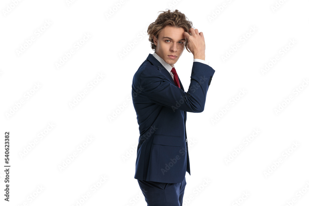 confident businessman with blue eyes arranging and fixing hairstyle confident businessman with blue eyes arranging and fixing hairstyle