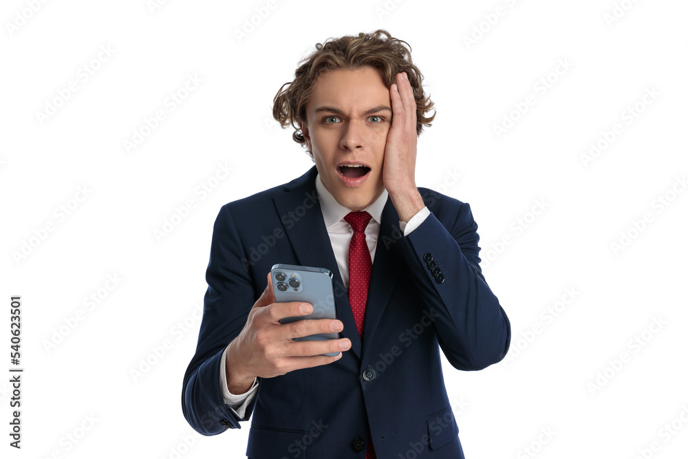shocked young businessman scrolling on social media and reading the news shocked young businessman scrolling on social media and reading the news