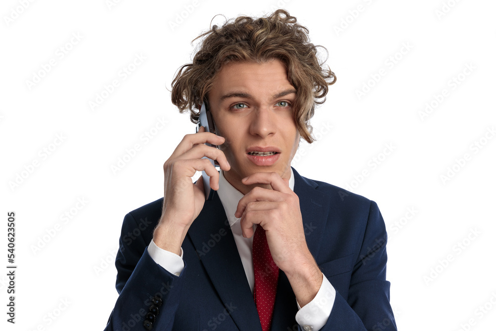 thoughtful man having a discussion on the phone and thinking thoughtful man having a discussion on the phone and thinking