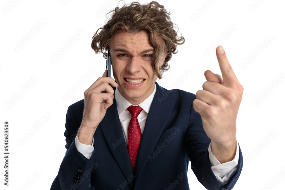 angry businessman talking on the phone and being upset angry businessman talking on the phone and being upset