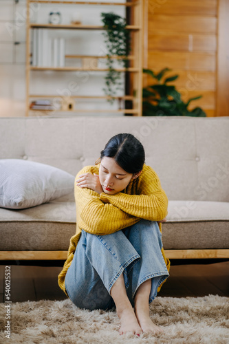 Young woman sit Depression Dark haired pensive glance Standing by window and anxiety Copy space. .